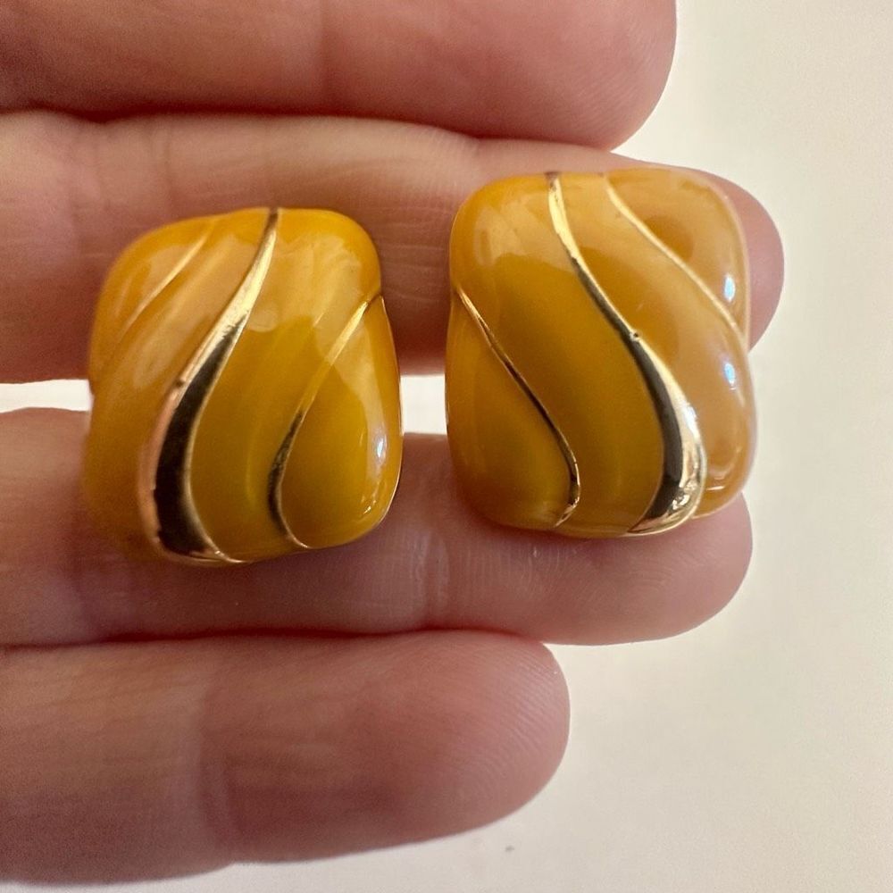 Yellow enamel and gold tone clip on earrings